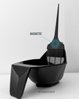 Black magnetic hair color bowl that is holding the brush out of the bowl by magnets.