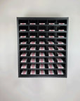 Shades Eq hair color organizer cabinet. Black modular cabinet that manages hair color for salons.